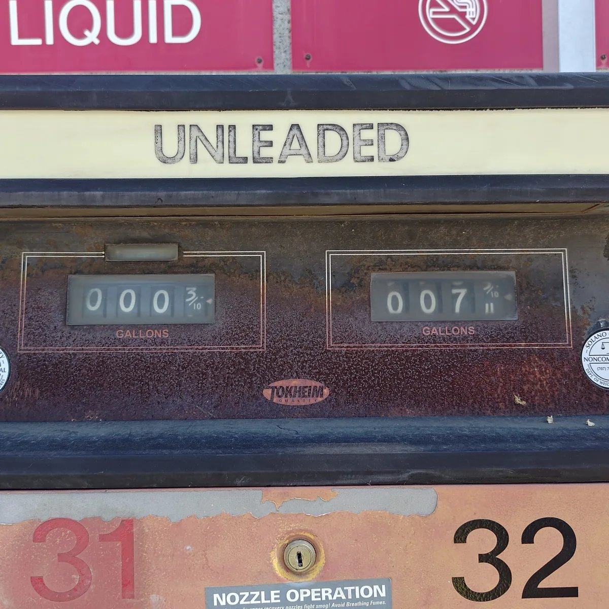 Mechanical unleaded gasoline pump with rotary counters.