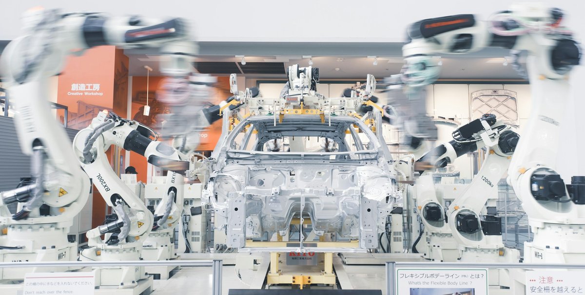 Robotic arms on a car assembly line