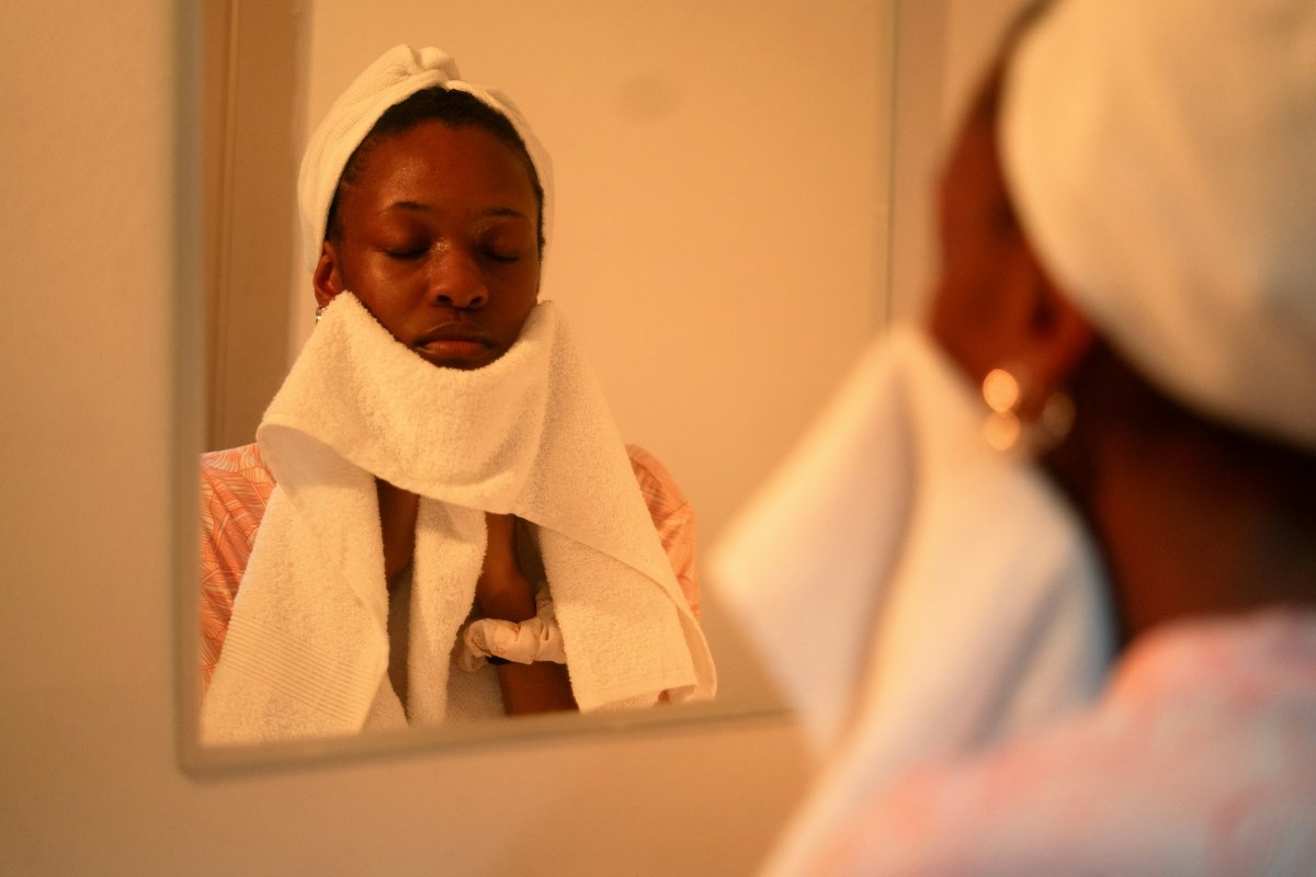 A woman washing her face