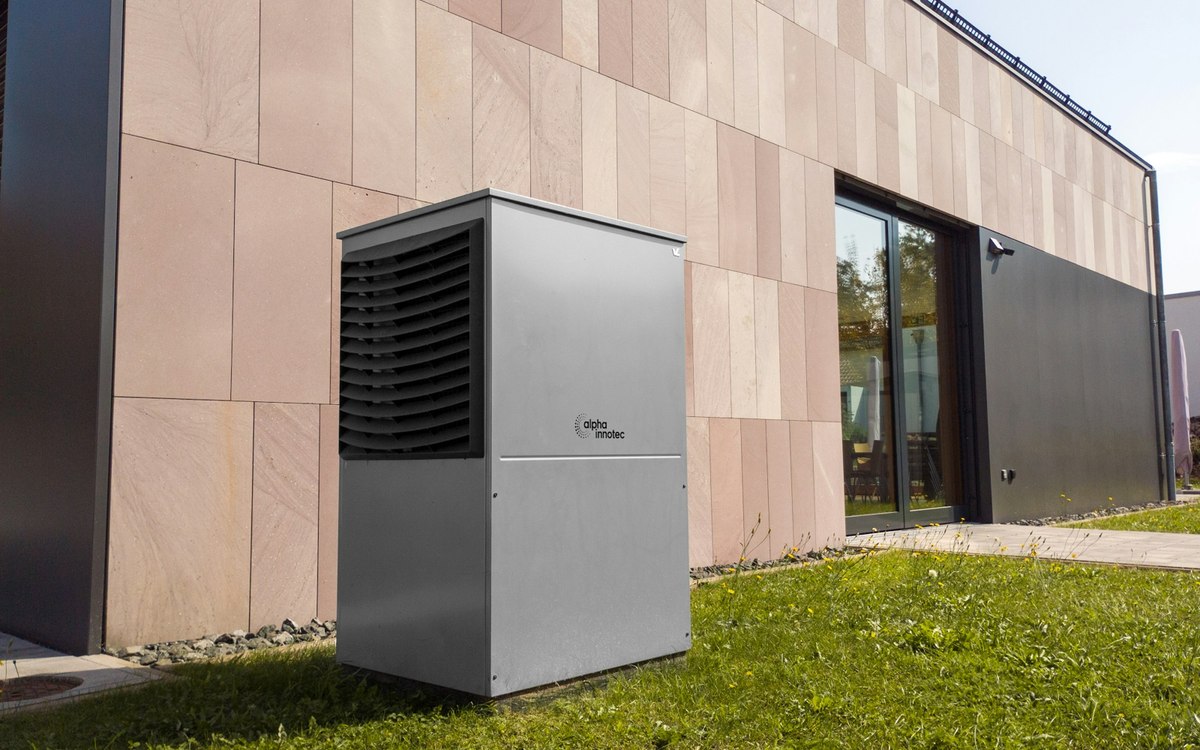 Outdoor heat pump beside a modern building