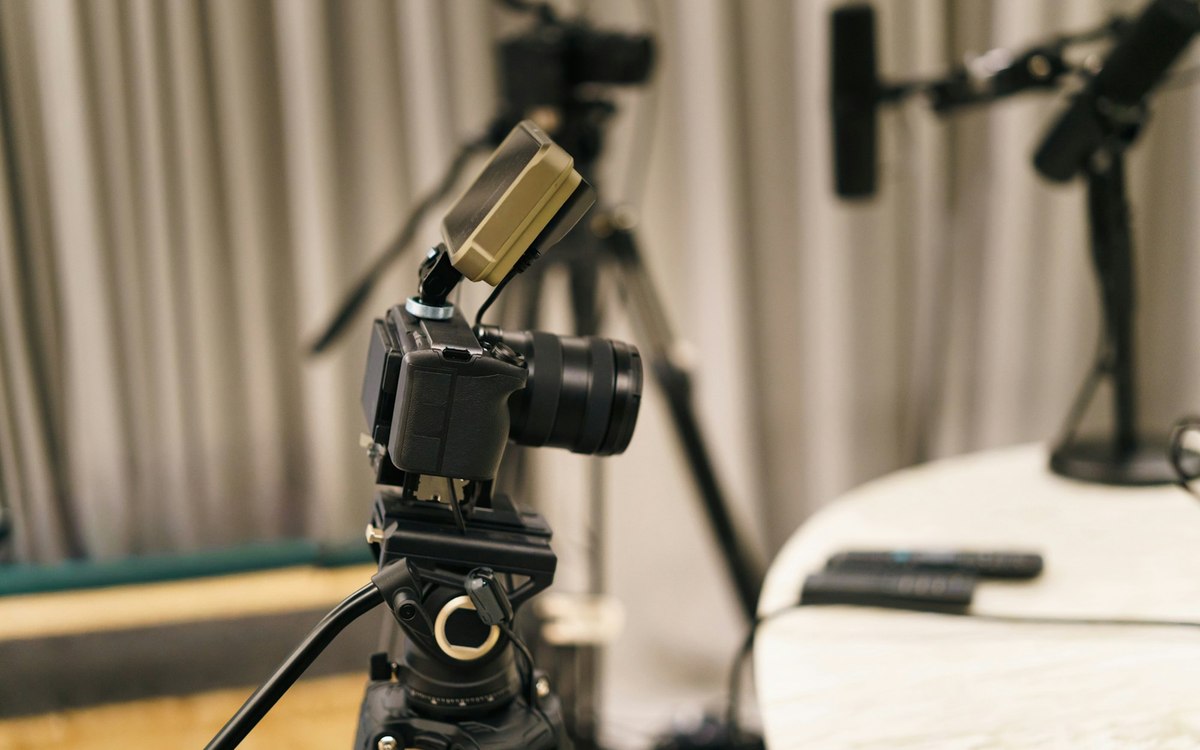 Camera and microphone on a tripod in a recording room